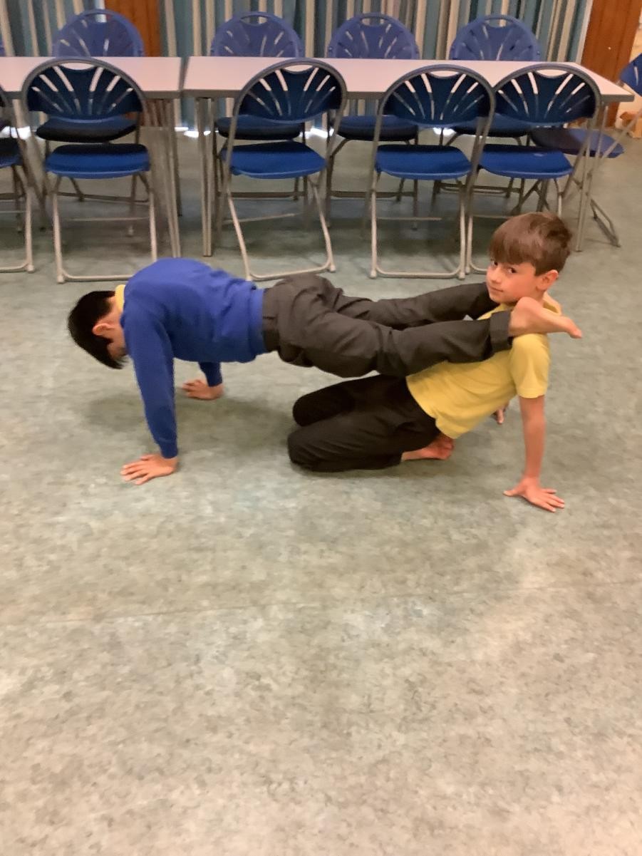 Exploring partner balances during gymnastics.