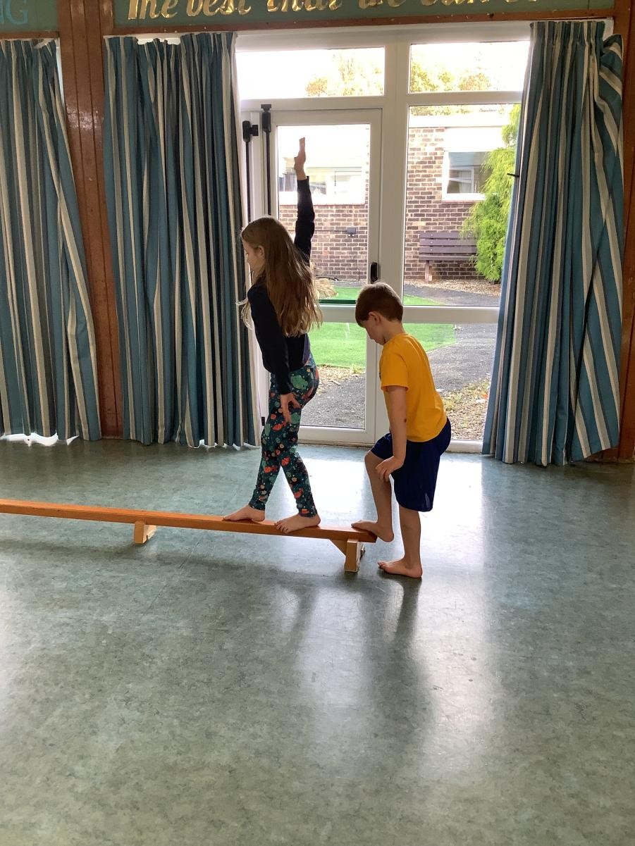 Exploring balancing, travelling over and across equipment safely and using large apparatus in gymnastics. 