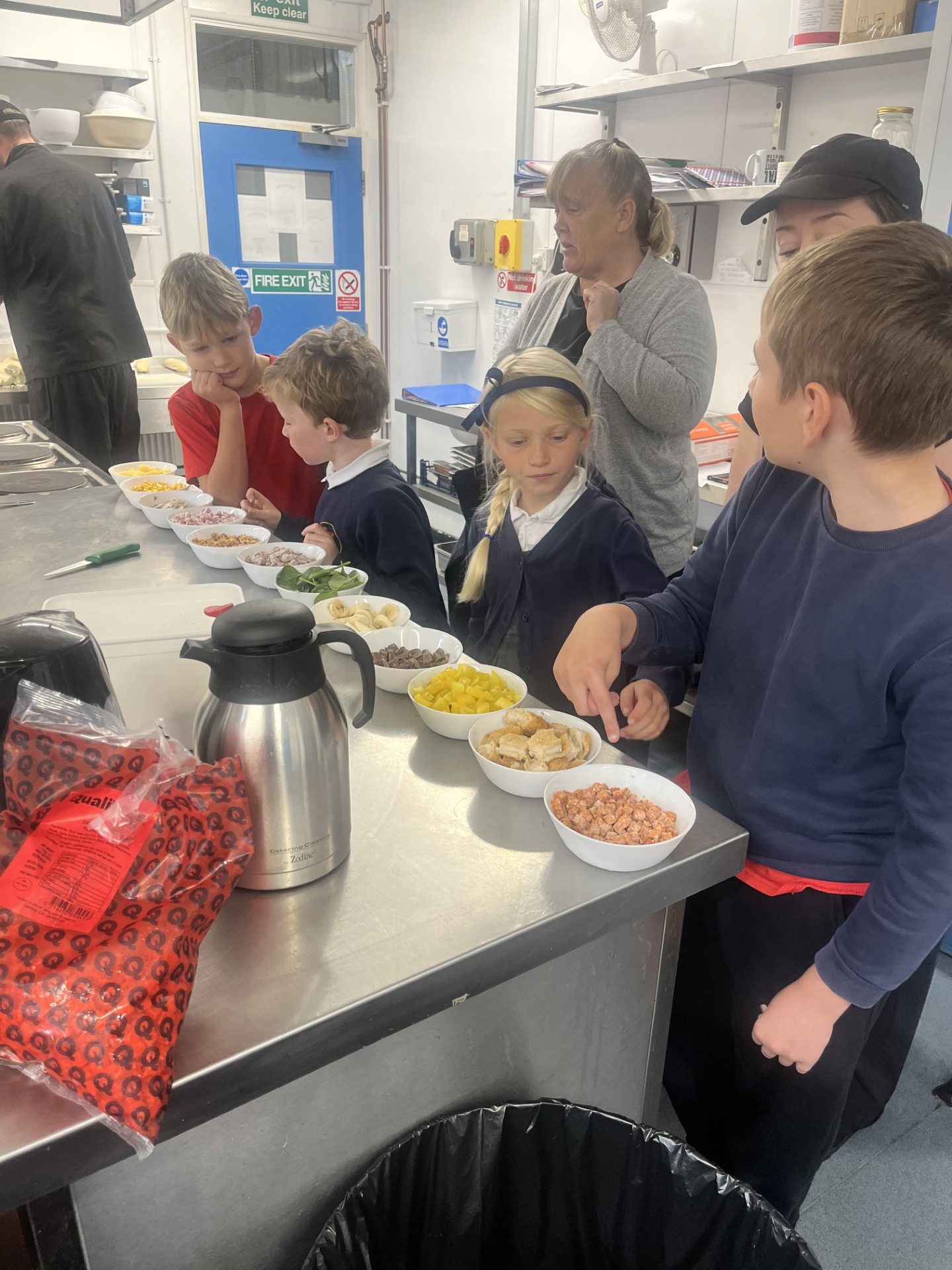 Creating our own pizzas. 