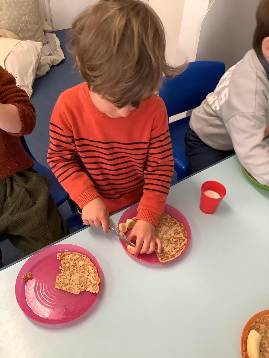 Child chopping fruit