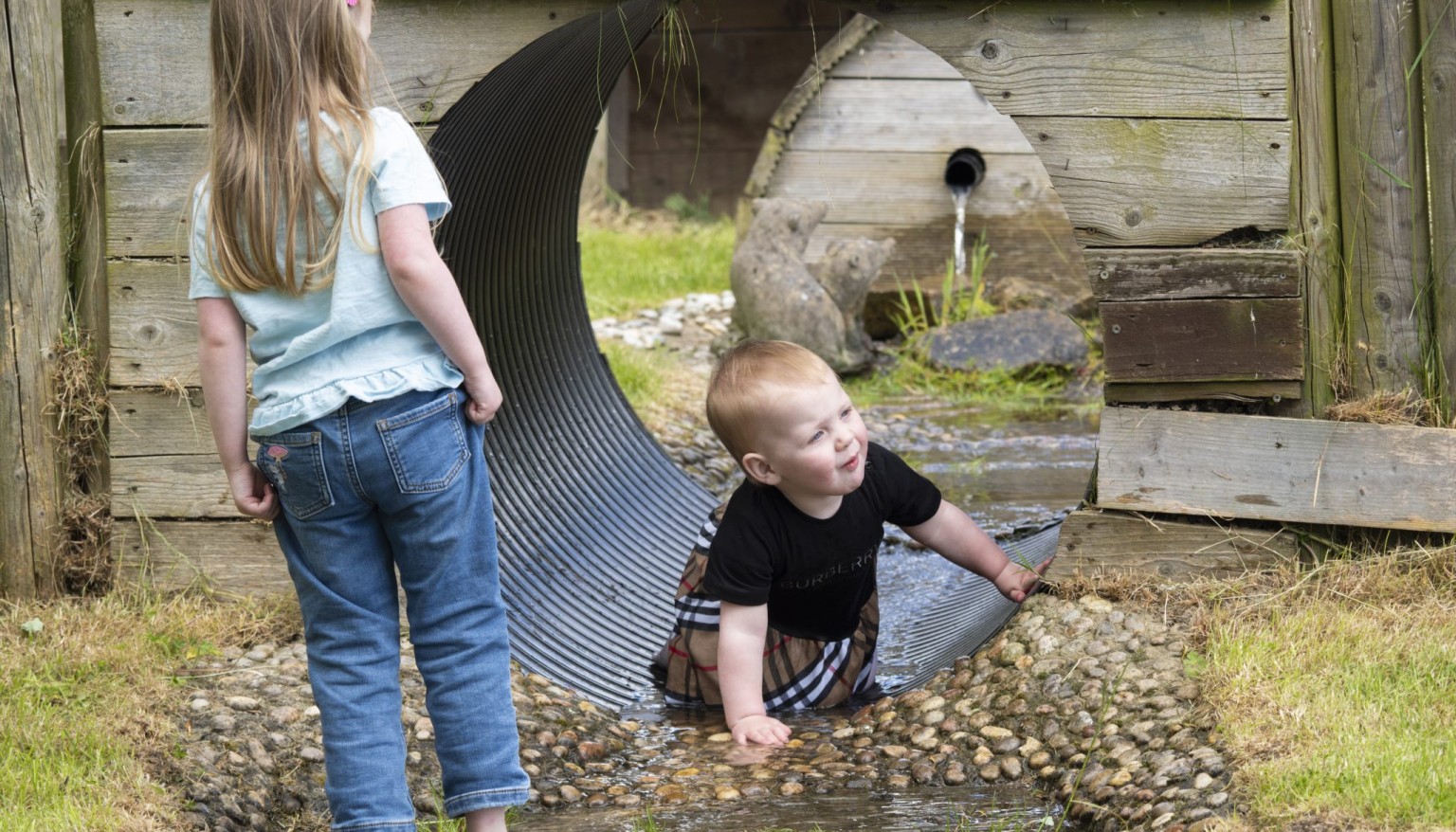 Children playing in stream