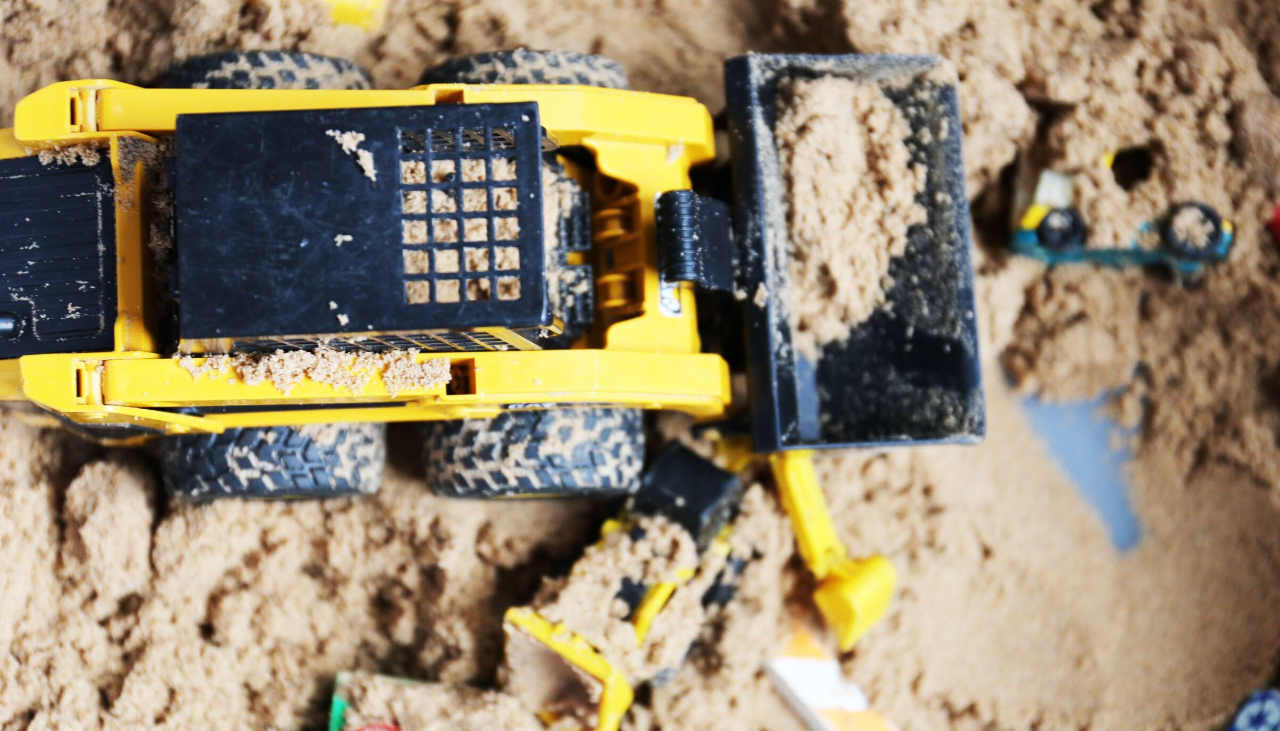 dumper truck being used in the sand