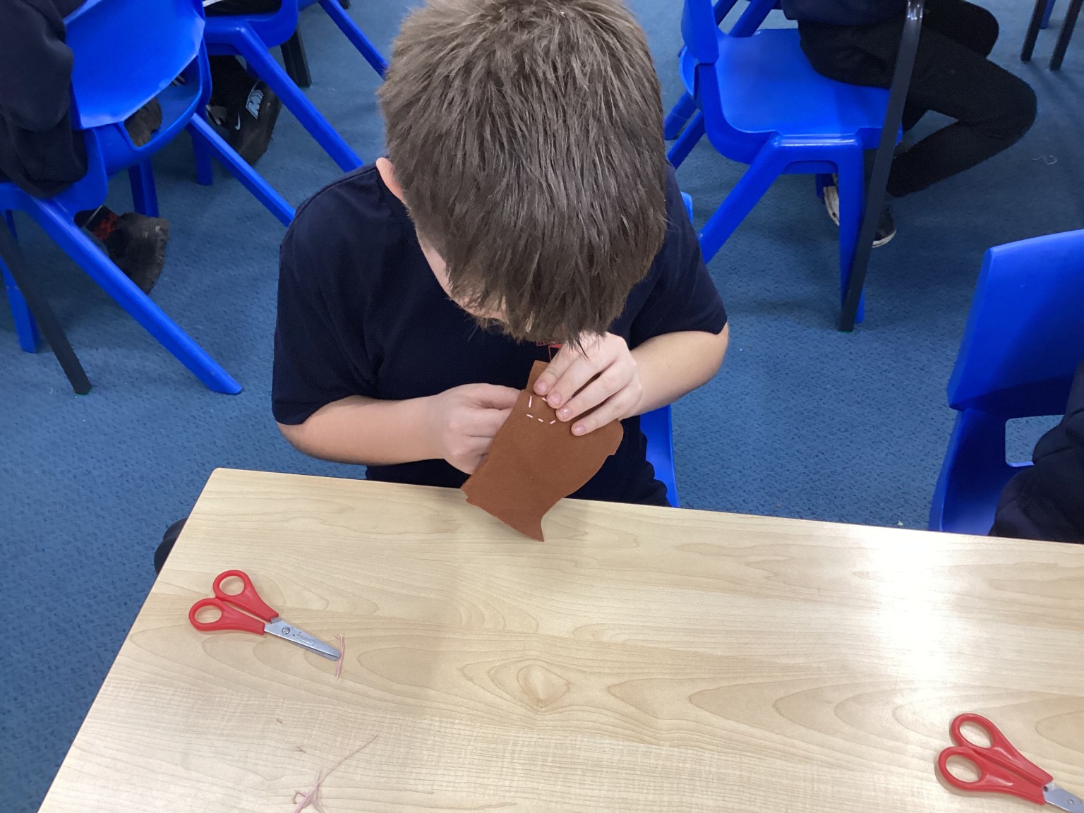 DT - We practised sewing techniques.