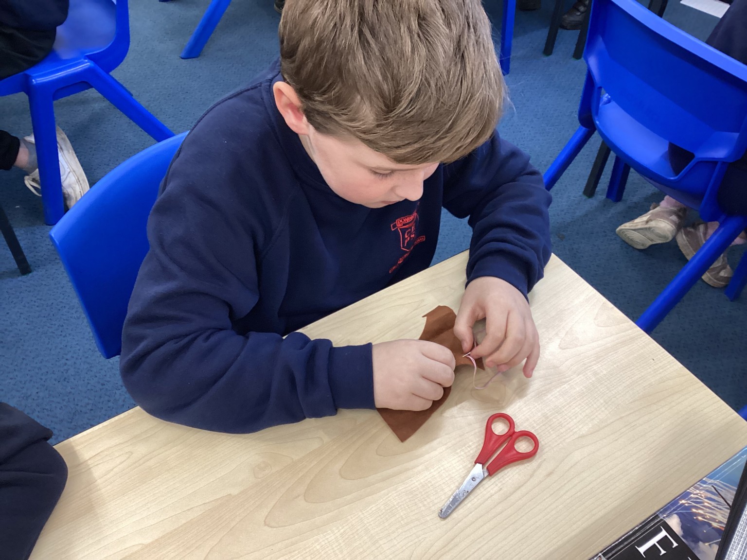 DT - We practised sewing techniques.