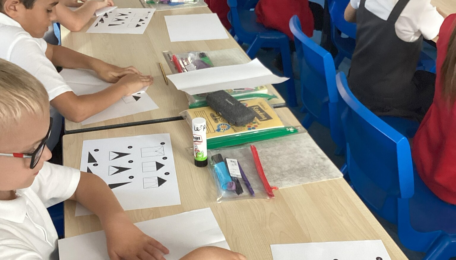 Making paper aeroplanes in science to see the effects of air resistance!