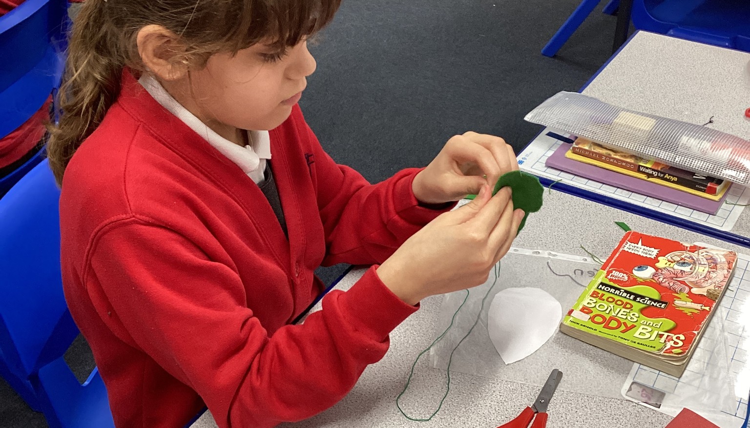 Sewing soft toys for book bags for nursery.