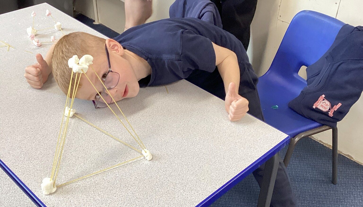 Making sculptures using spaghetti and marshmallows in art!