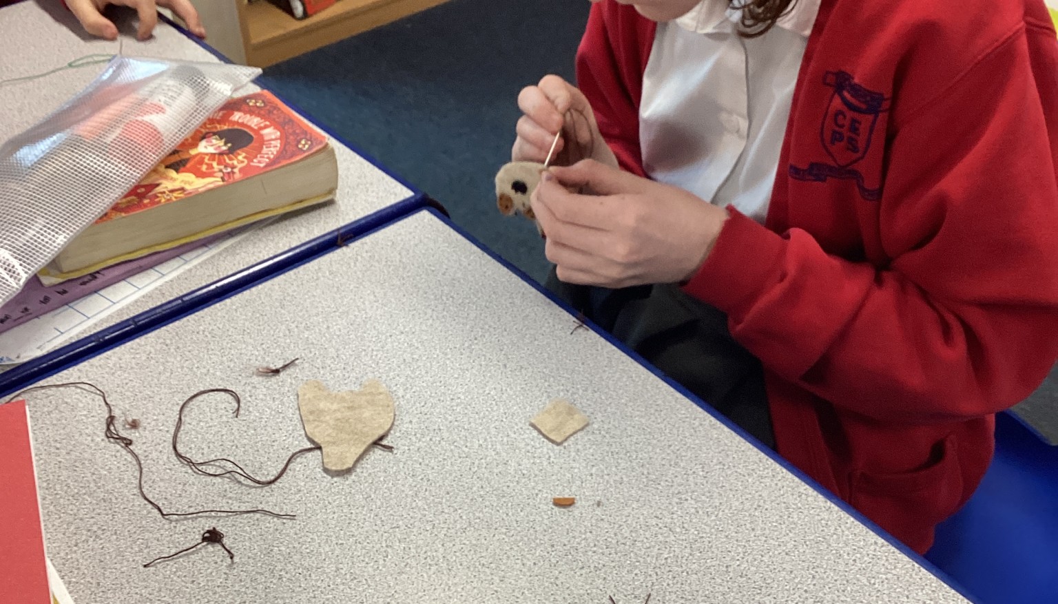 Sewing soft toys for book bags for nursery.