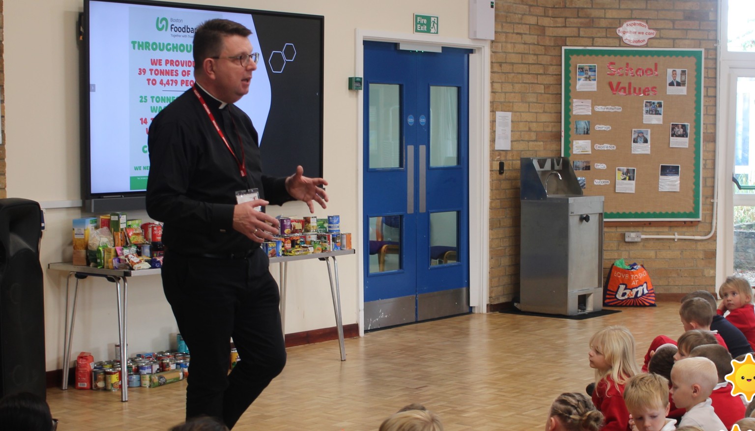 Father David speaking in assembly 