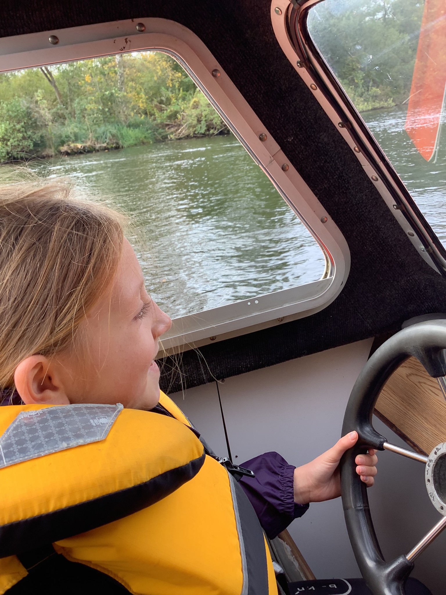 We drove a boat down the Norfolk Broads.