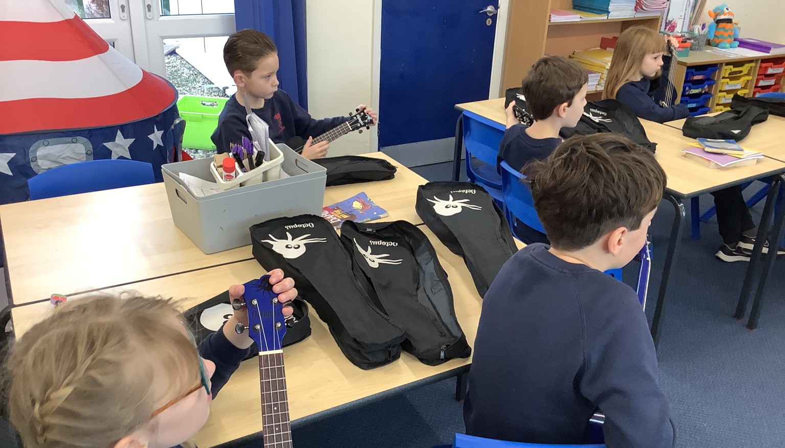 In music, we have started to learn the ukulele. We spent our first lesson practicing holding the ukulele, strumming and playing a C chord.