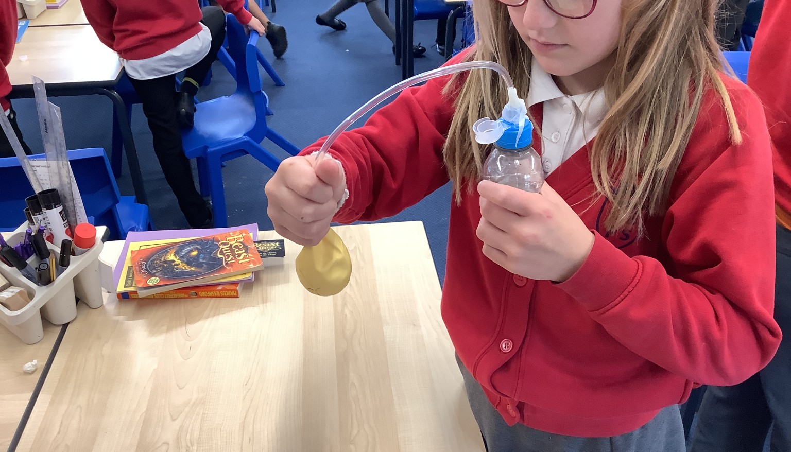 In DT, we created a pneumatic mechnaism to inflate a balloon using a bottle.