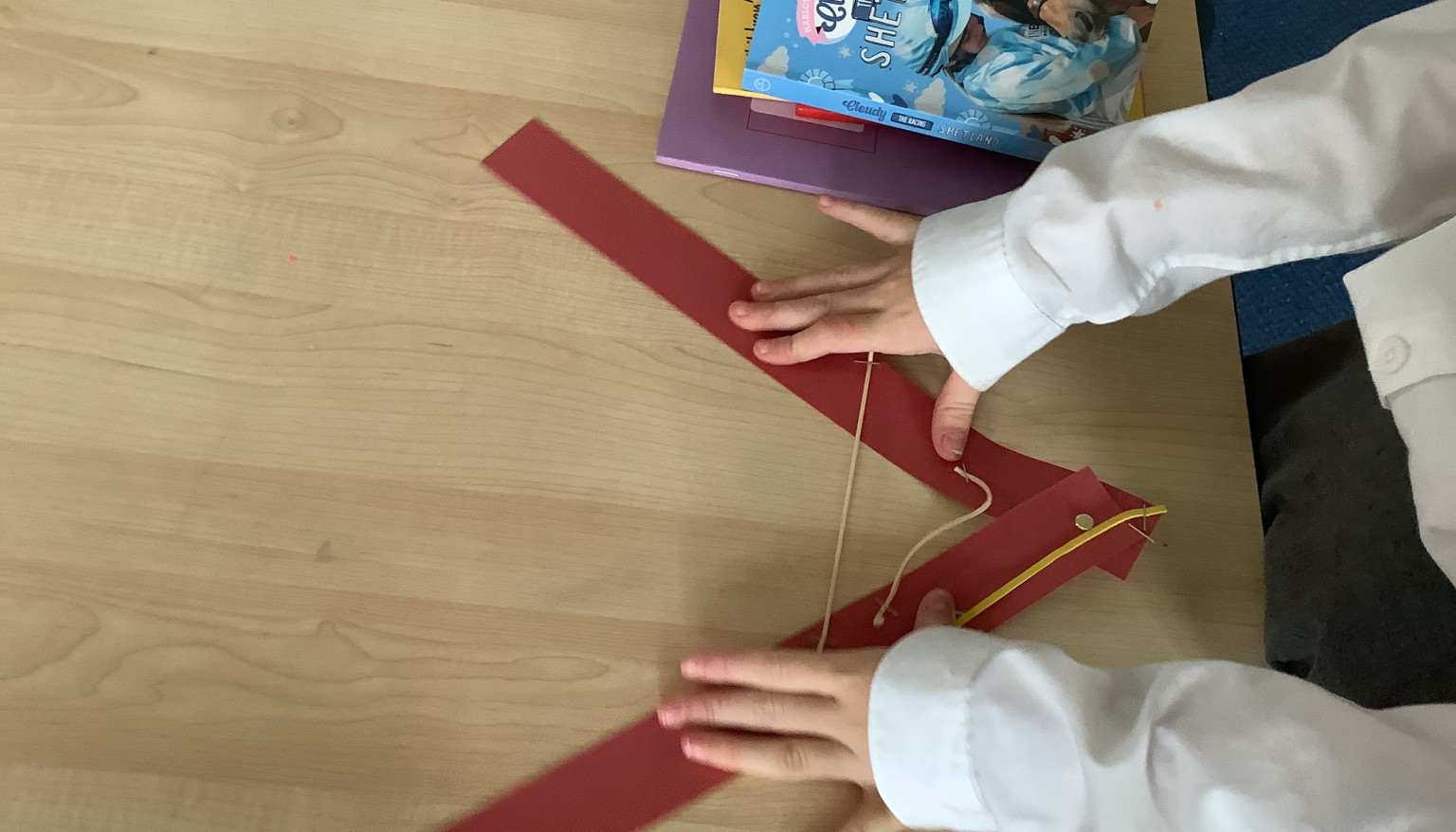 In science, we used pins, paper and elastic bands to demonstrate the use of muscles.