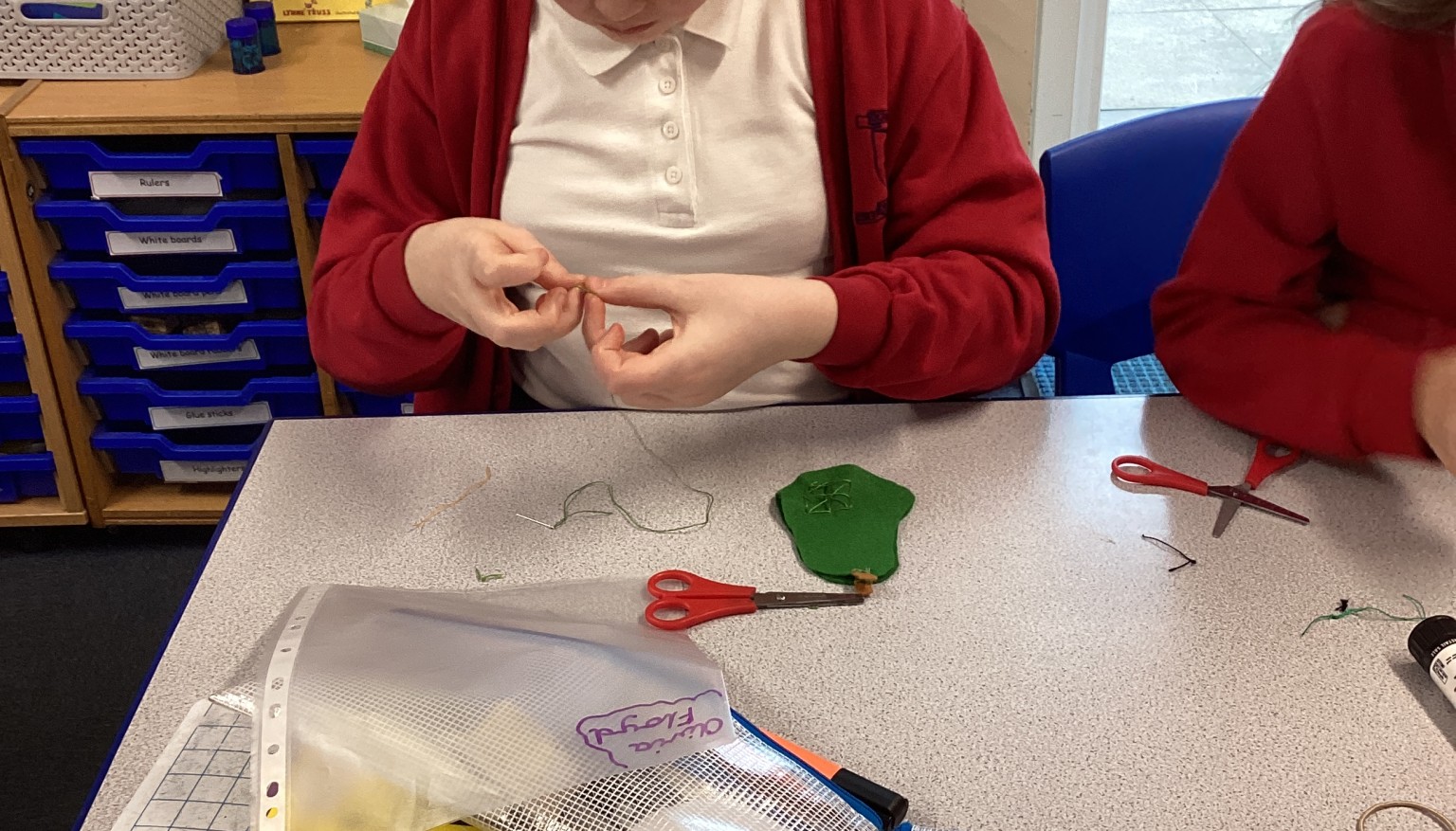 Sewing soft toys for book bags for nursery.