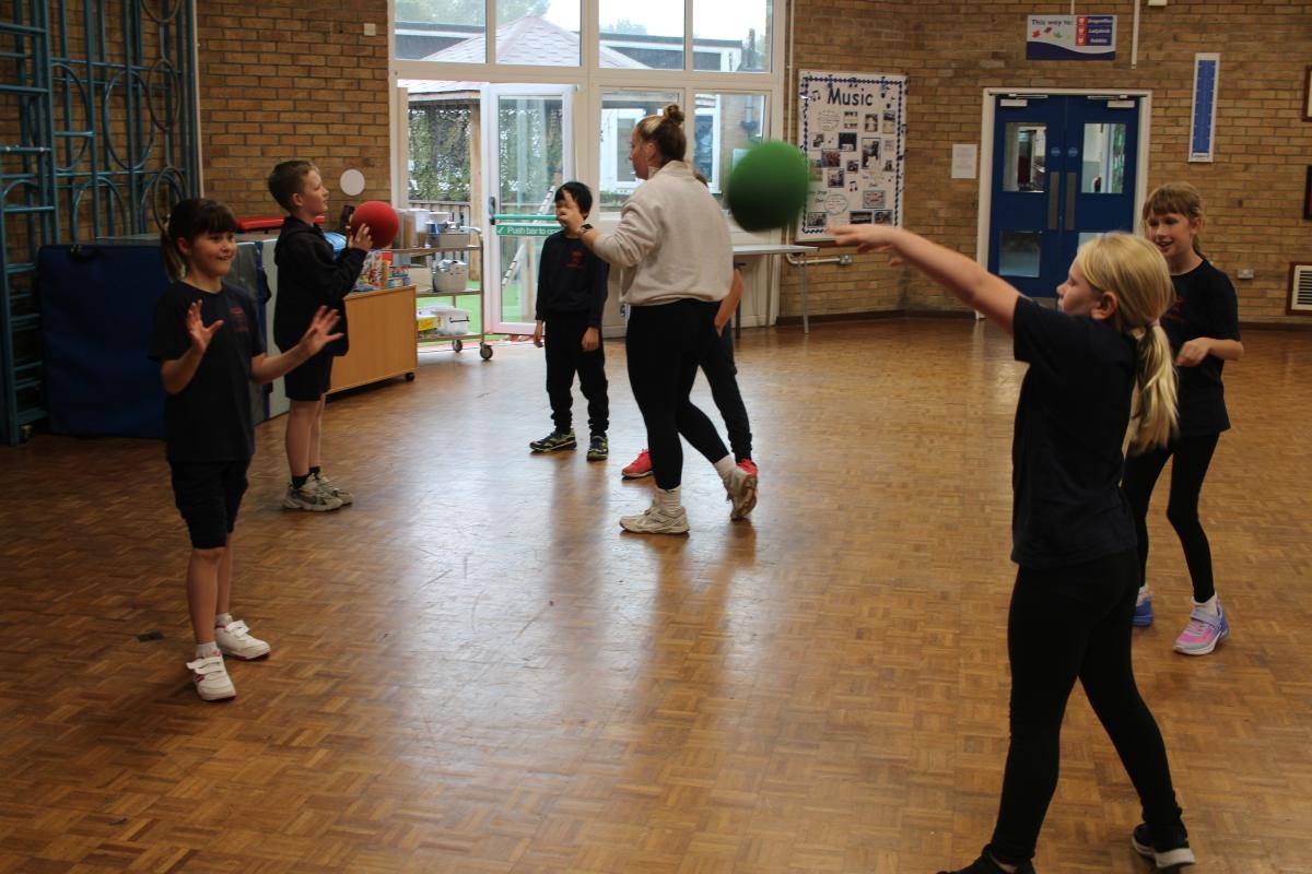 Children have been practicing their throwing and catching skills and learning the rules of Netball.