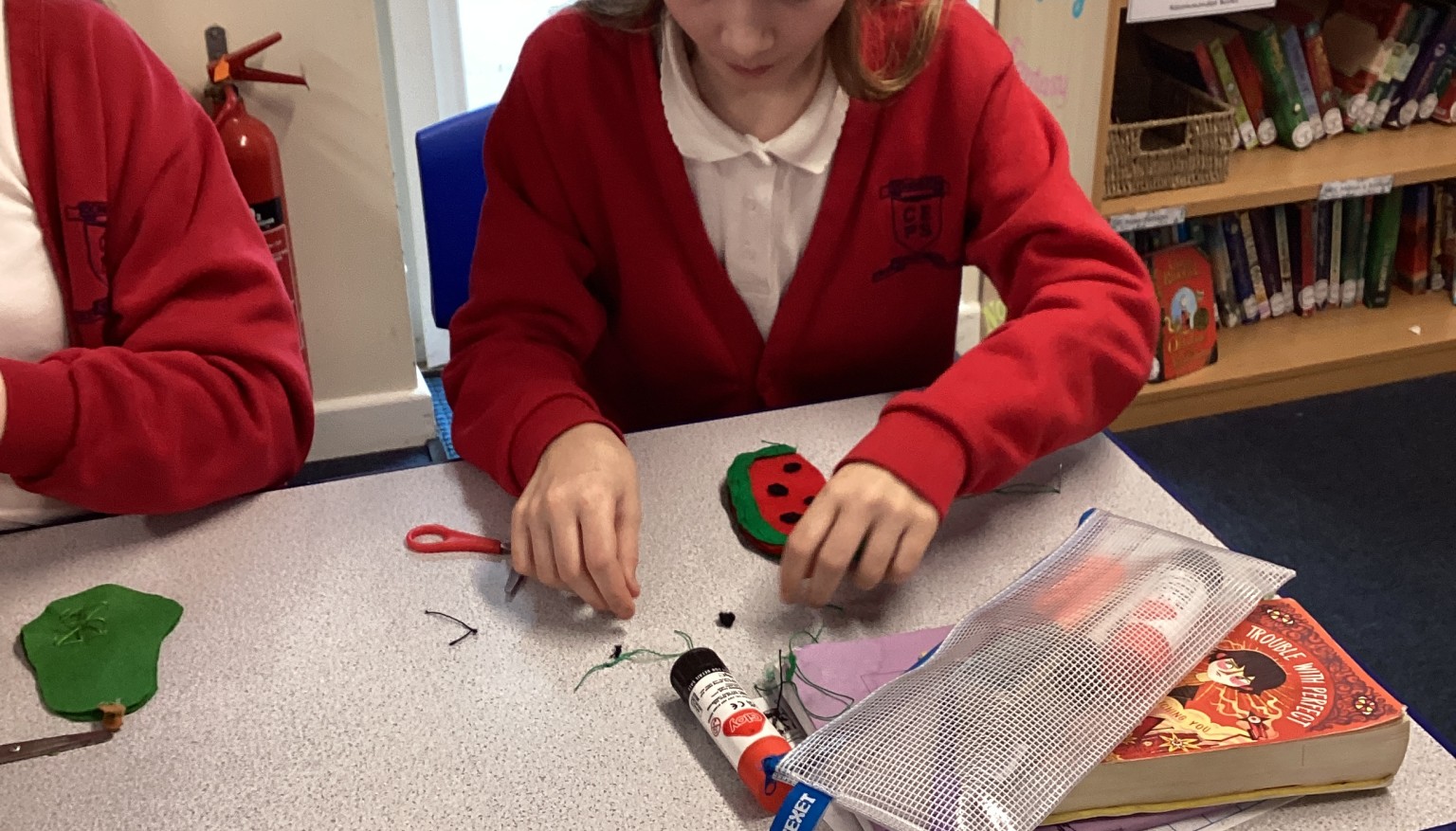 Sewing soft toys for book bags for nursery.