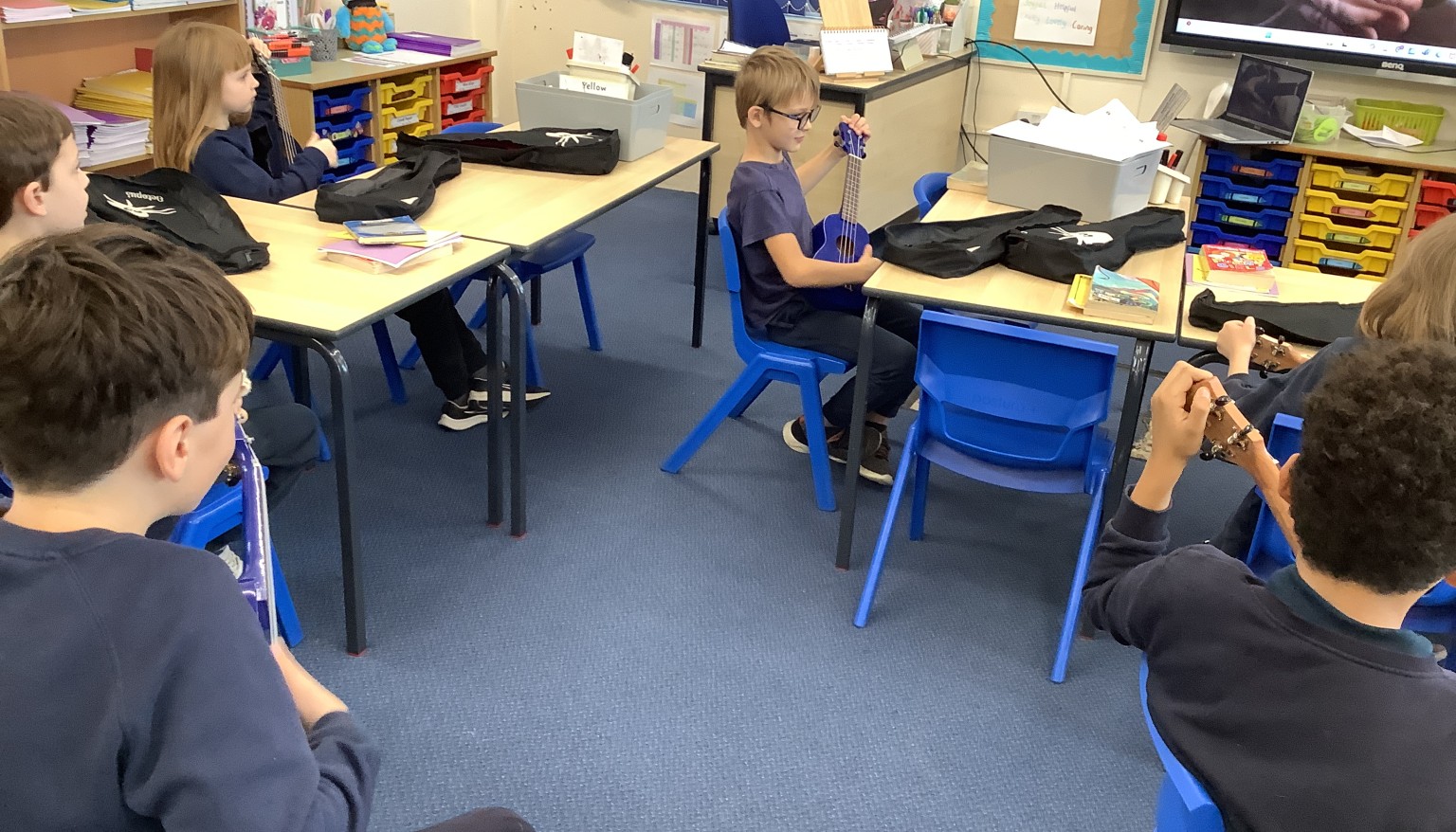 In music, we have started to learn the ukulele. We spent our first lesson practicing holding the ukulele, strumming and playing a C chord.