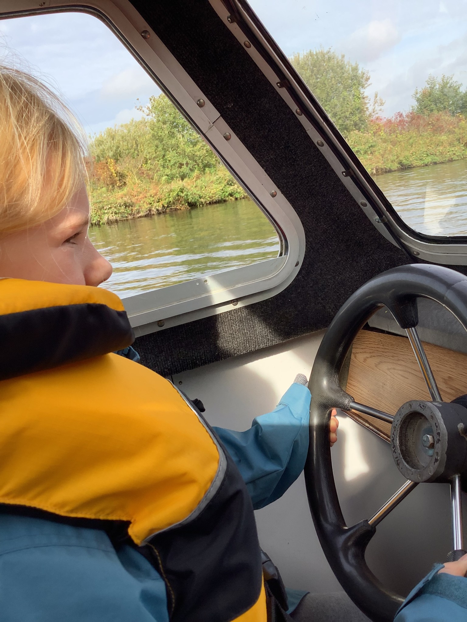 We drove a boat down the Norfolk Broads.