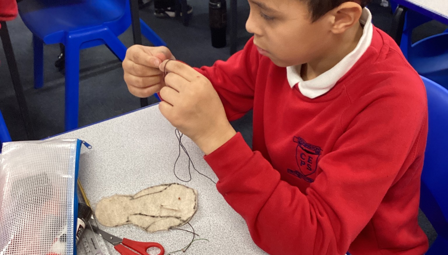 Sewing soft toys for book bags for nursery.