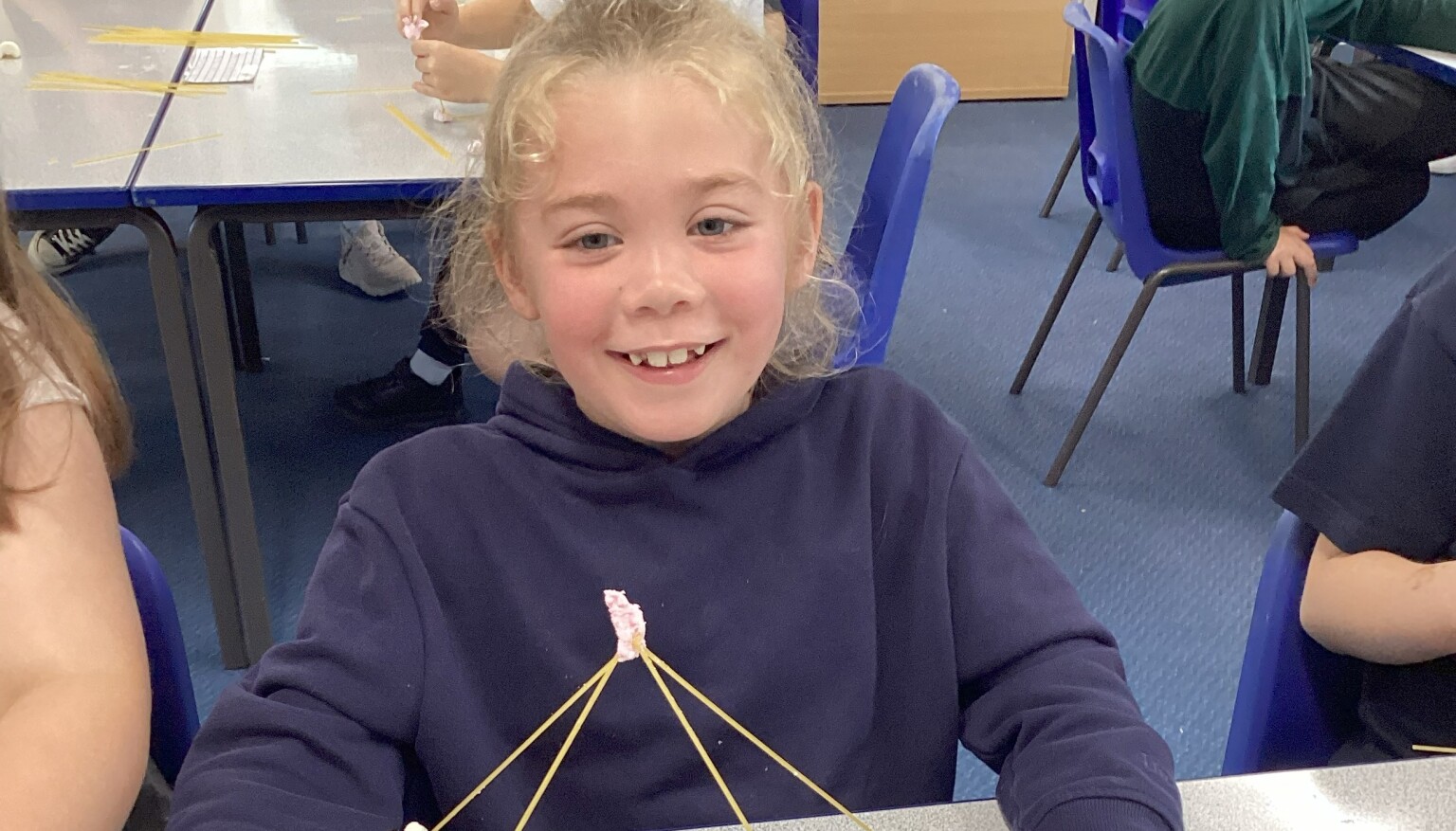 Making sculptures using spaghetti and marshmallows in art!