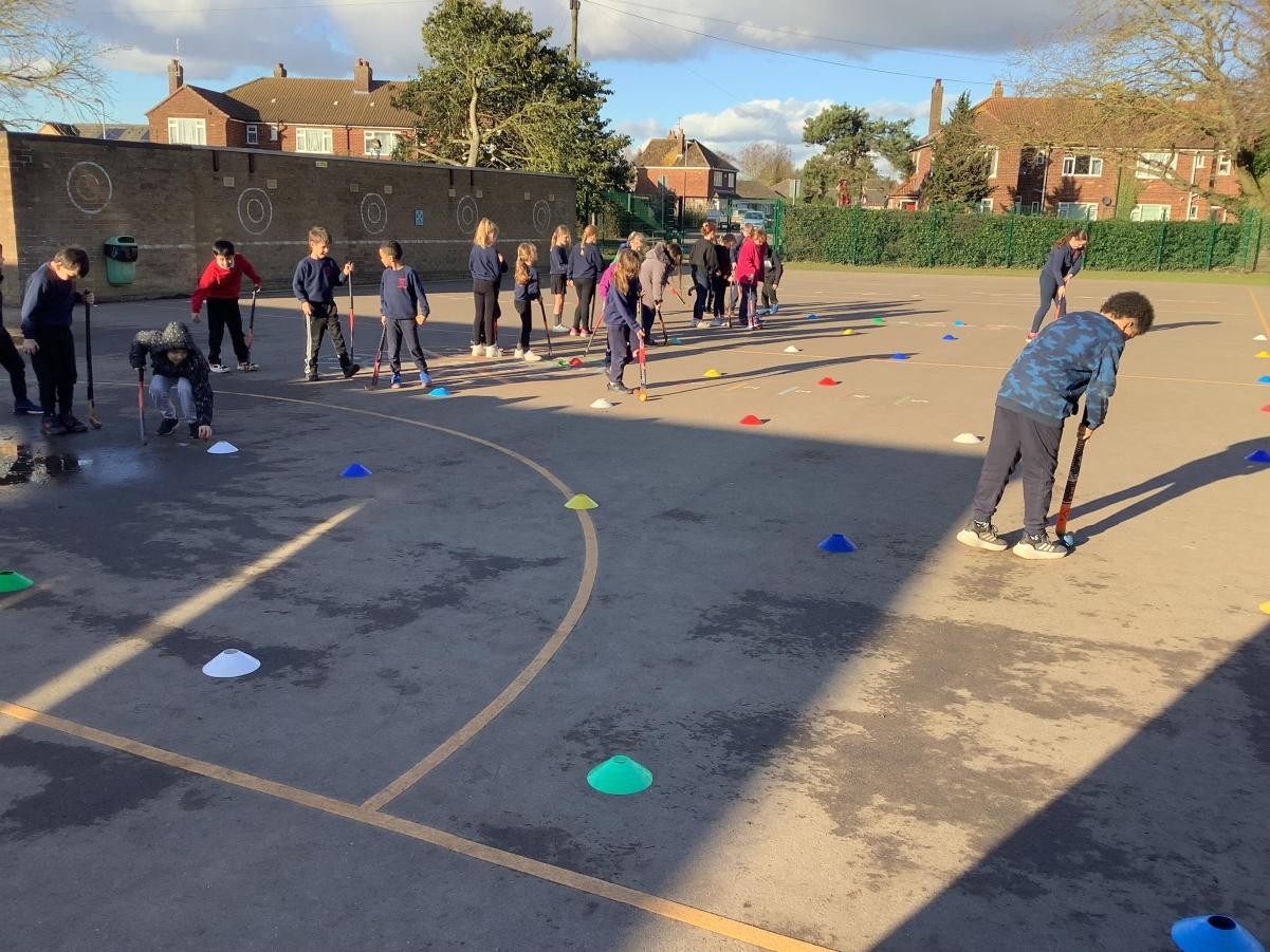 Today we practiced dribbling around cones to show our control of the ball.