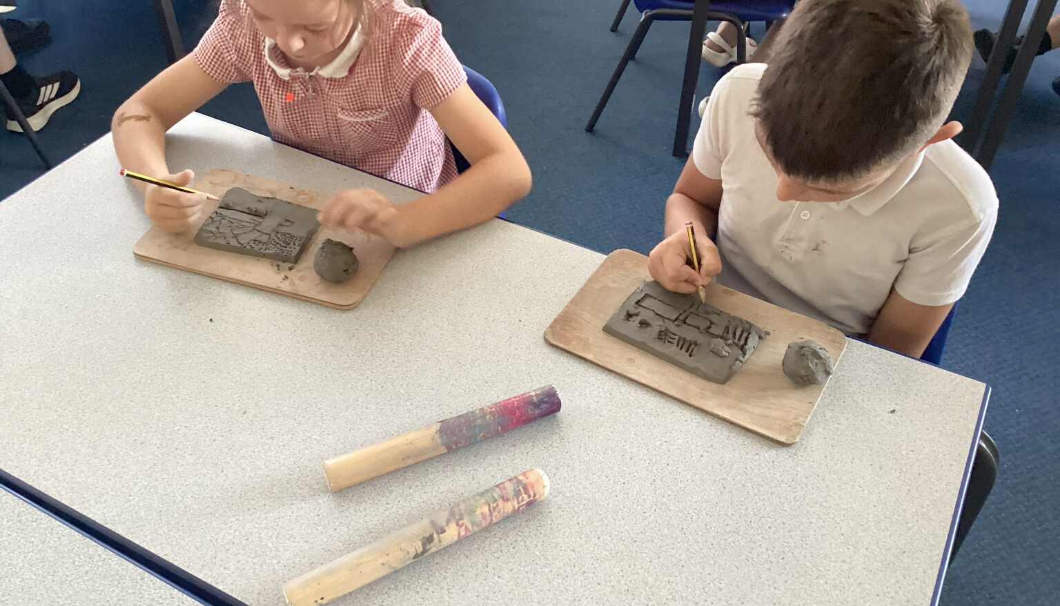 Making textured tiles using clay in art!
