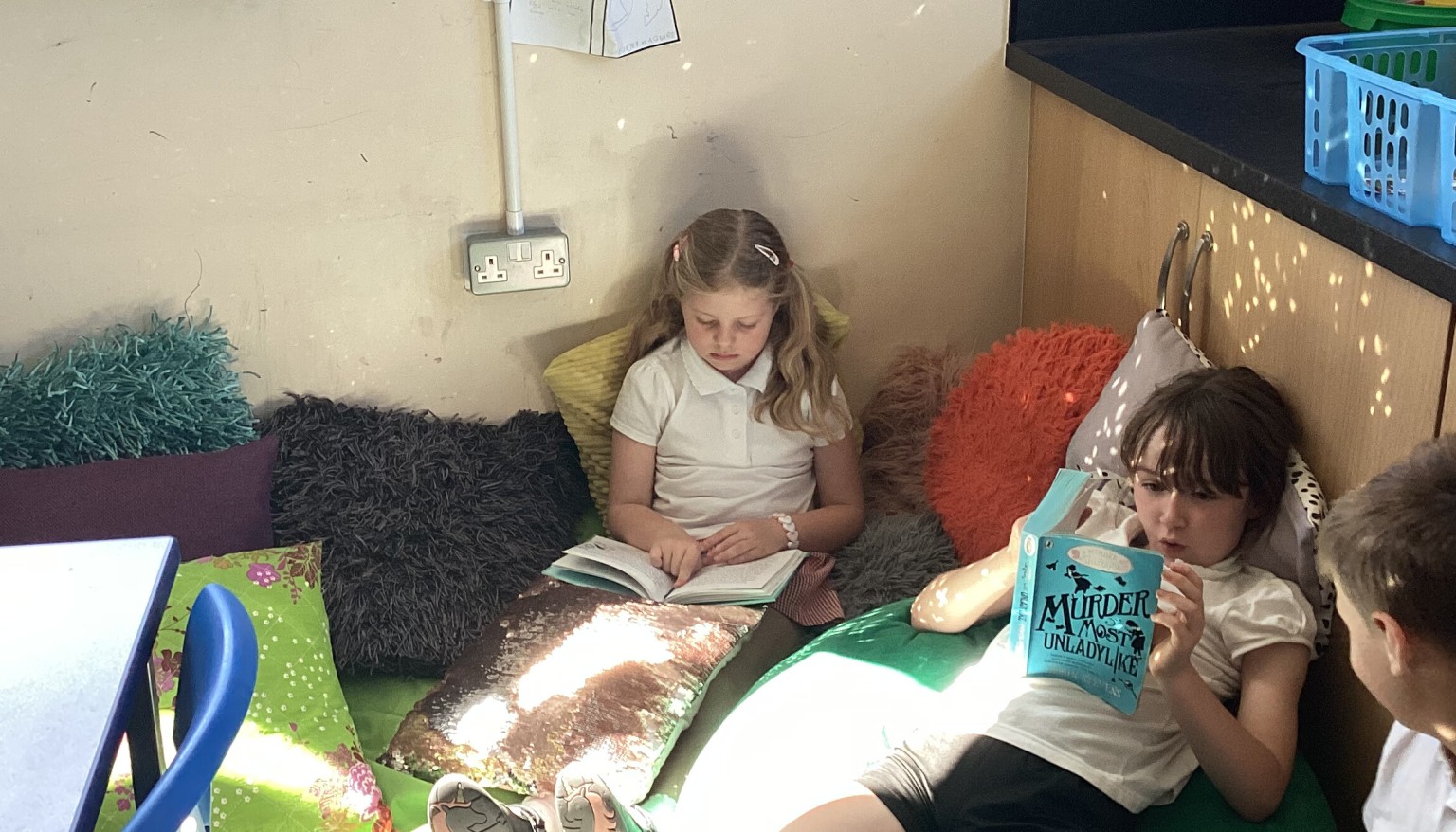 Quiet reading in our book corner