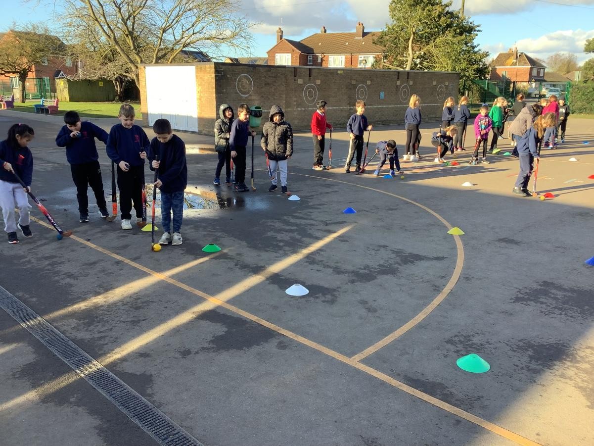 Today we practiced dribbling around cones to show our control of the ball.