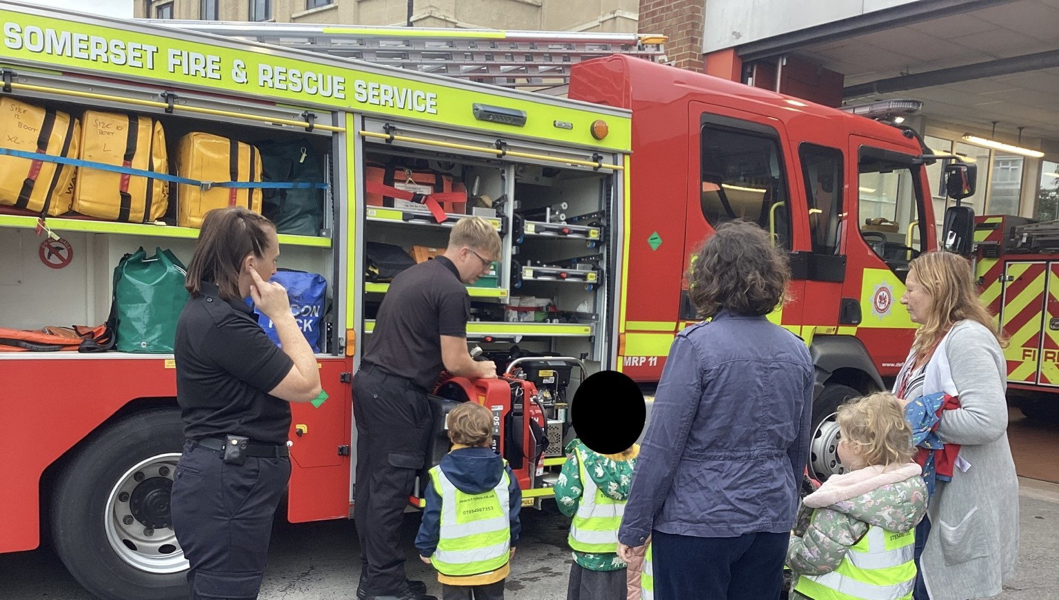 The class was split into two groups, taking it in turns to see what is kept in either side of the fire engine. 