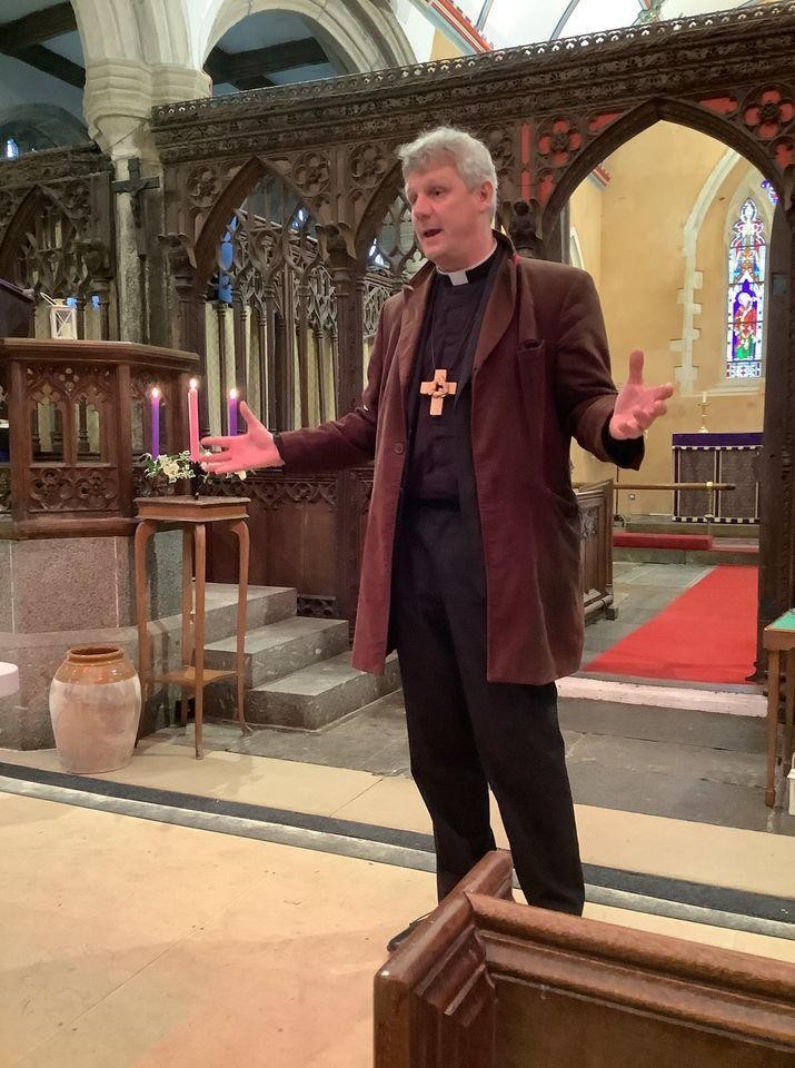 Bishop Mark leading a collective worship in St Michael's Church.