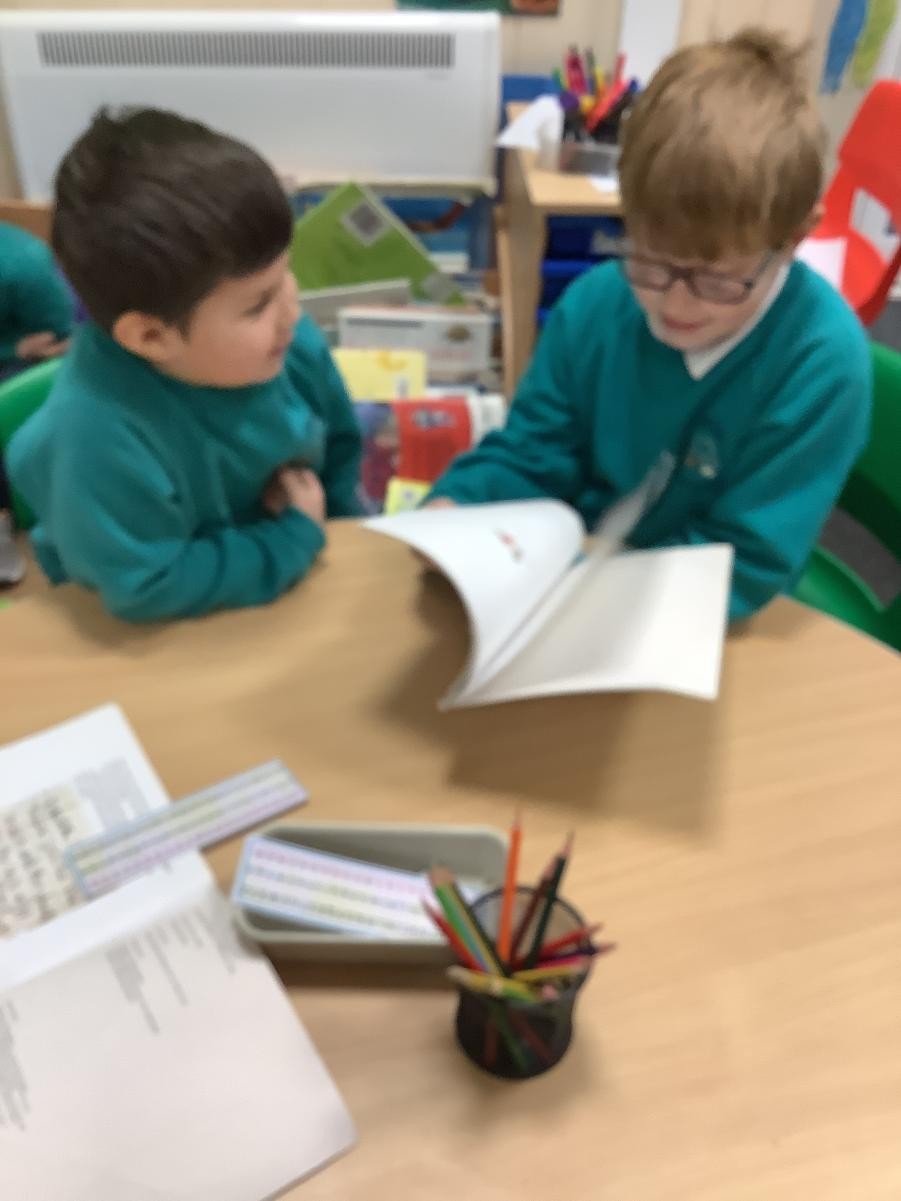 We Buddy Up and read to the younger children.