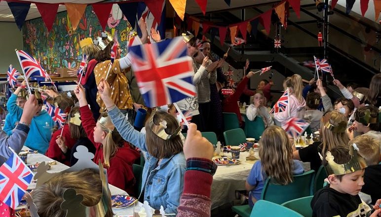 Children waving union jack flags