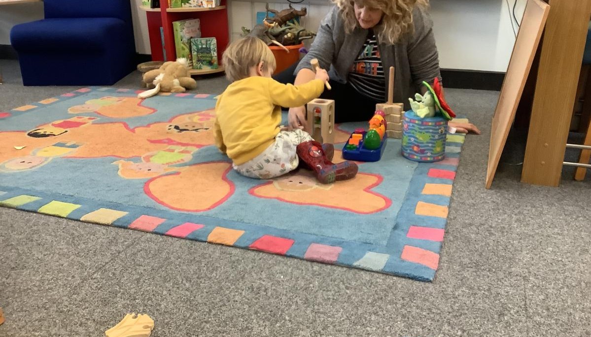 Child and adult playing 