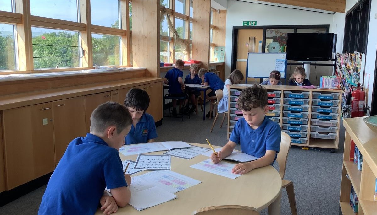 three children at a table 