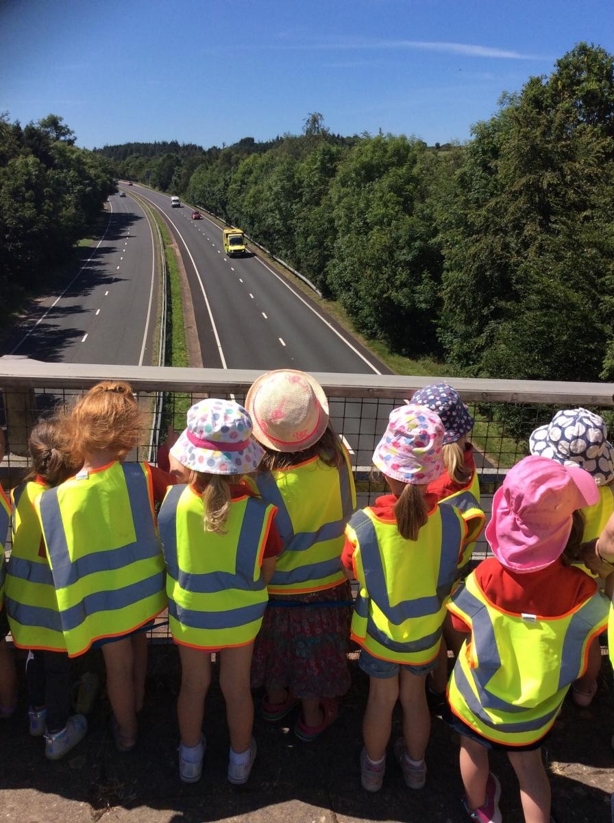 We watched the passing traffic and talked about the ambulance.