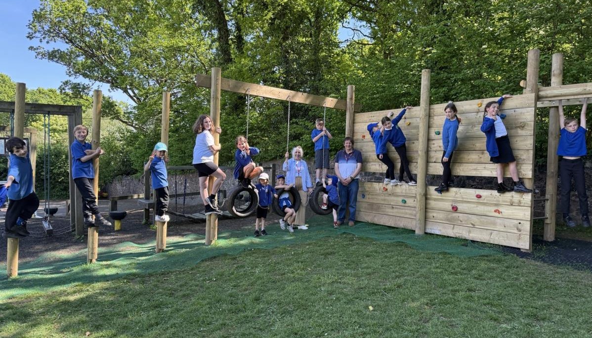 Children climbing on trim trail