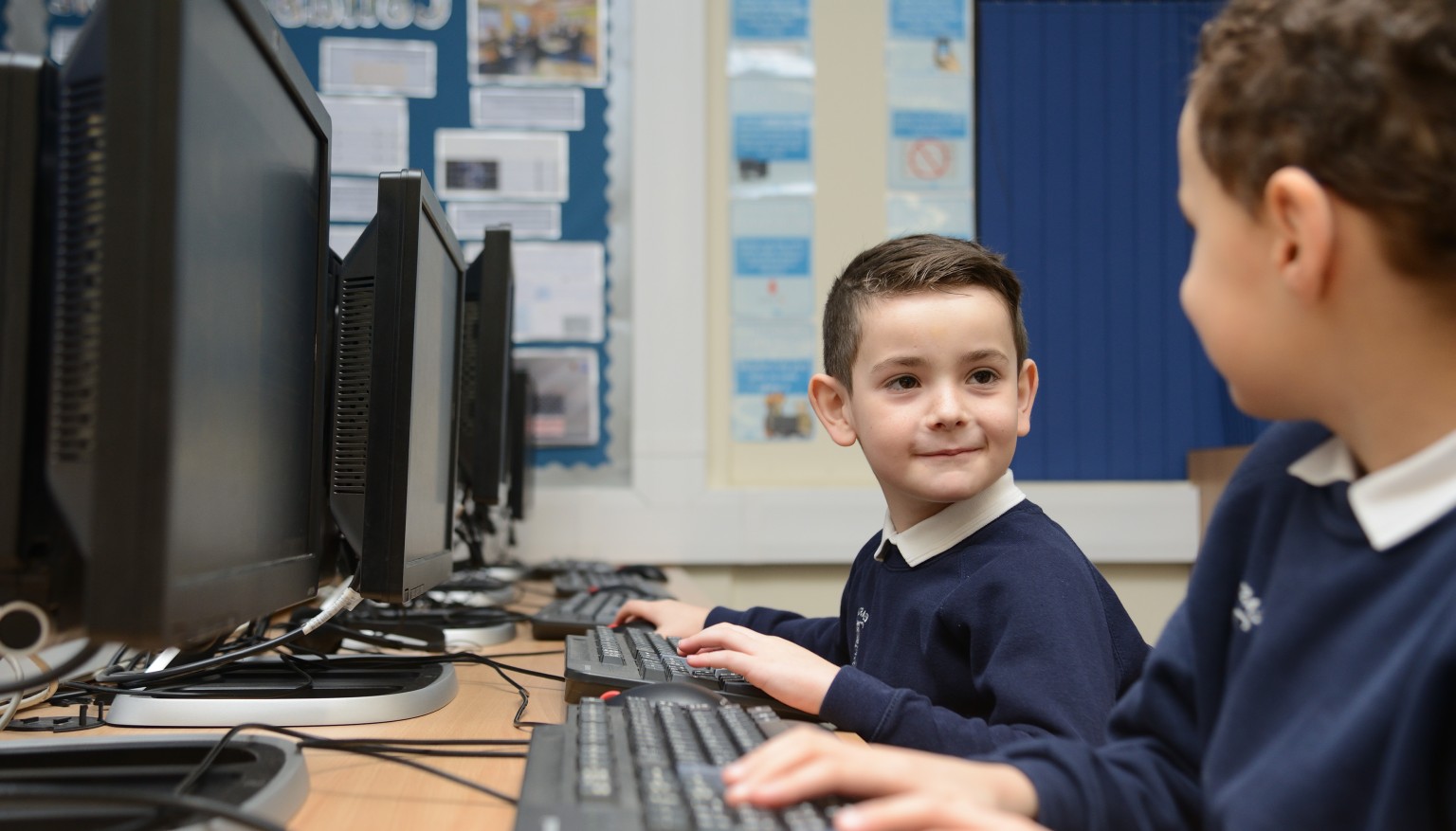 Two children at computers