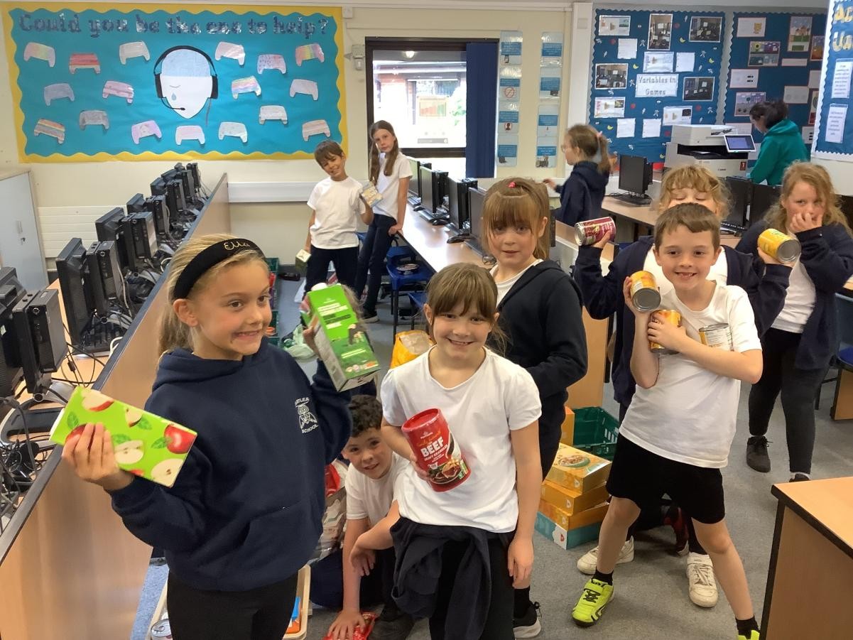 As well as bringing wellies for walking and and decorating stones...the children donated items for the Cramlington Food Bank.