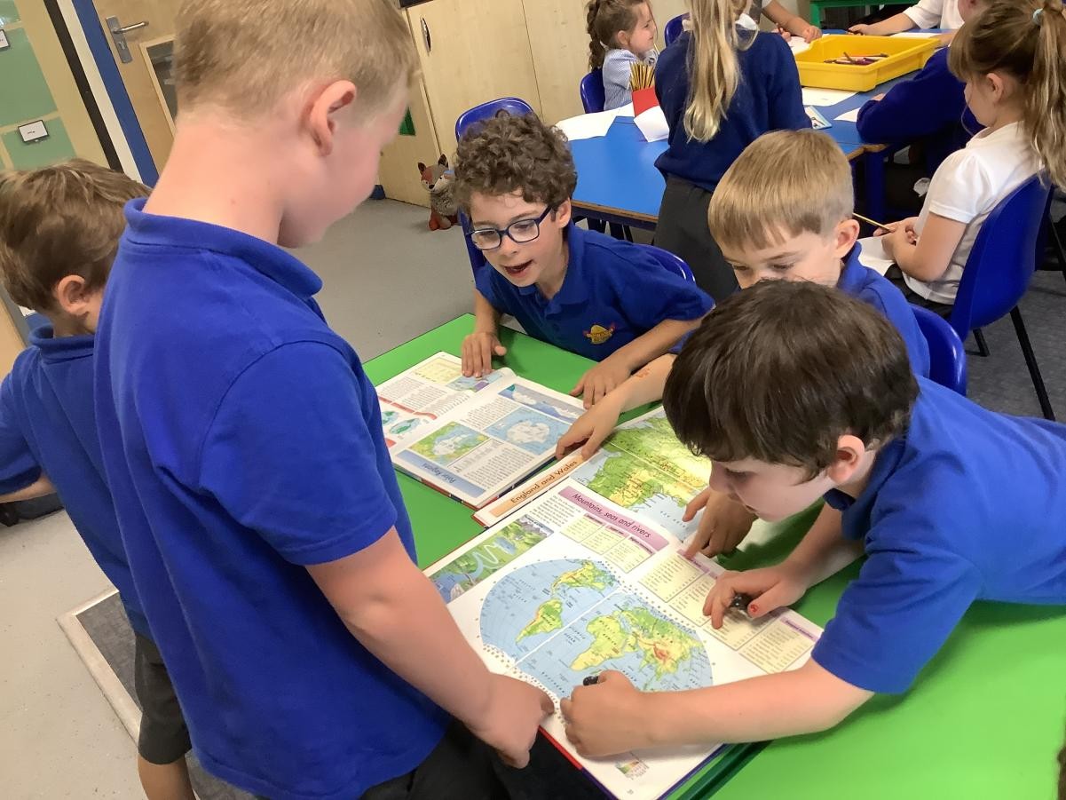 Geography lesson using atlases 