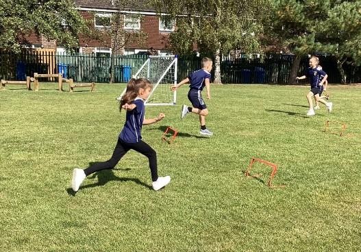 Pupils running on the field