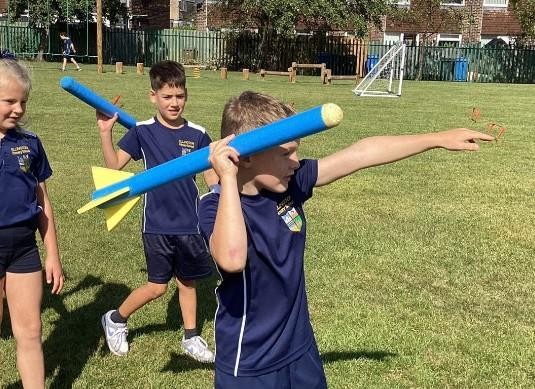 PE javelin lesson - pupils ready to throw