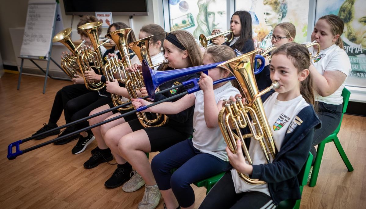 Group of children playing wind instruments 