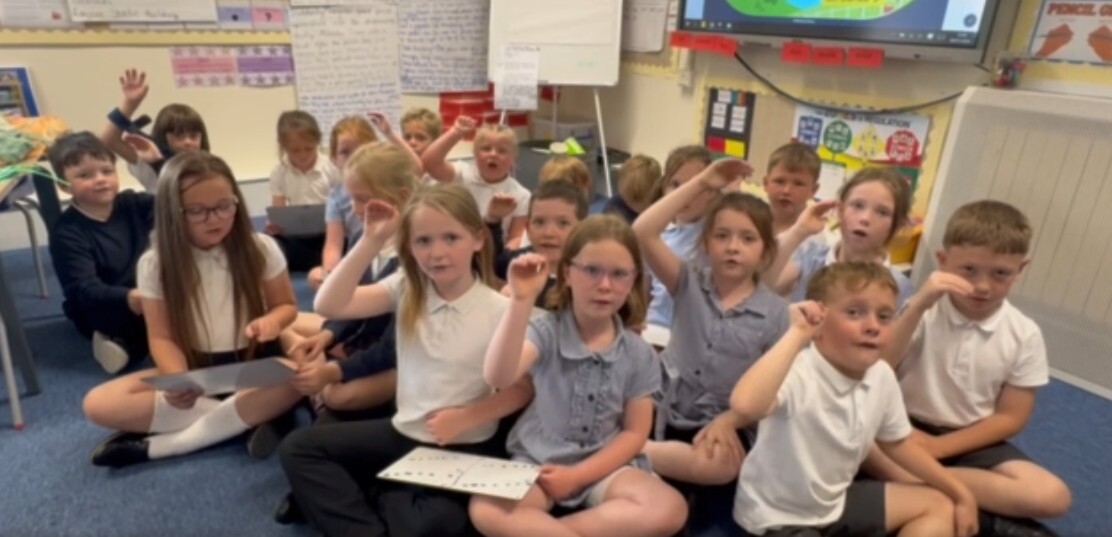 Using hands to show pitch in Key Stage 1 music lessons