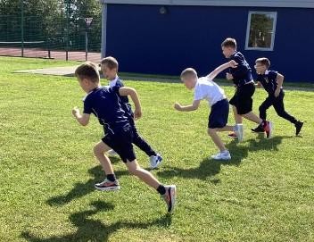 Pupils sprinting in PE