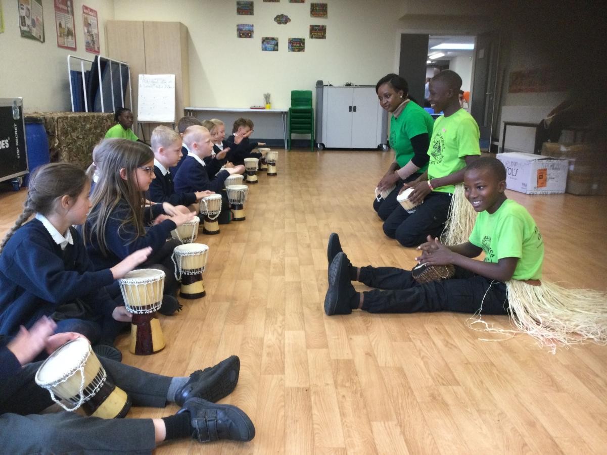 Year 3 doing a singing/drumming workshop with 'Pearl of Africa' choir