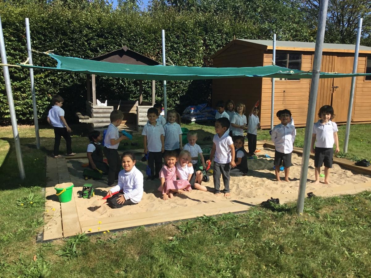 Playing together in the school sandpit