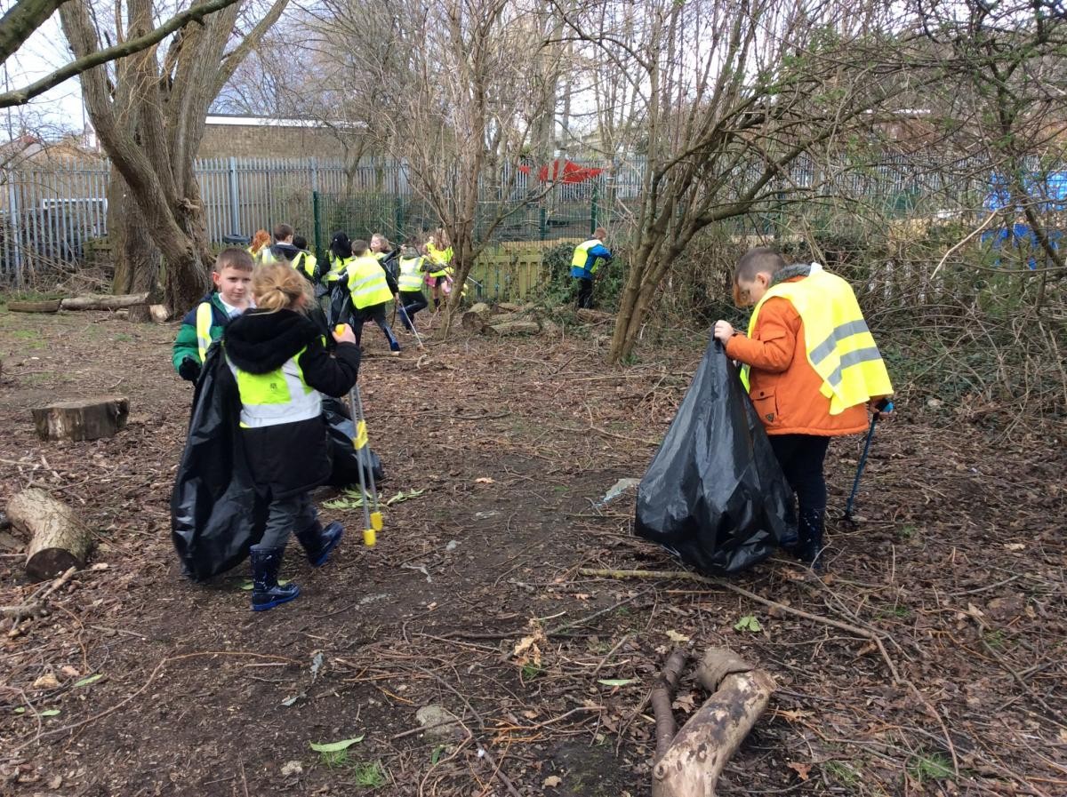 Year 2 working hard to make our Forest area litter free!