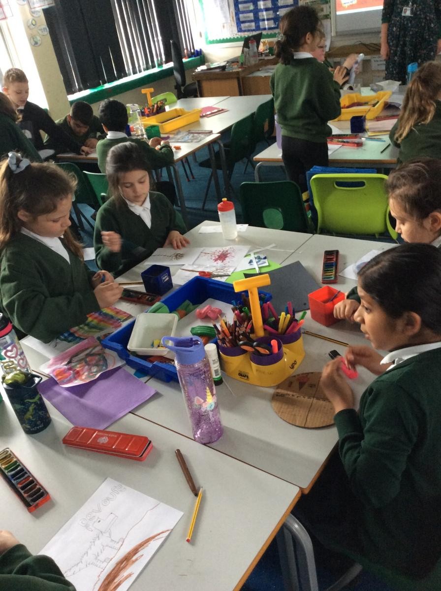 Year 4 selecting their own materials to design their own artwork