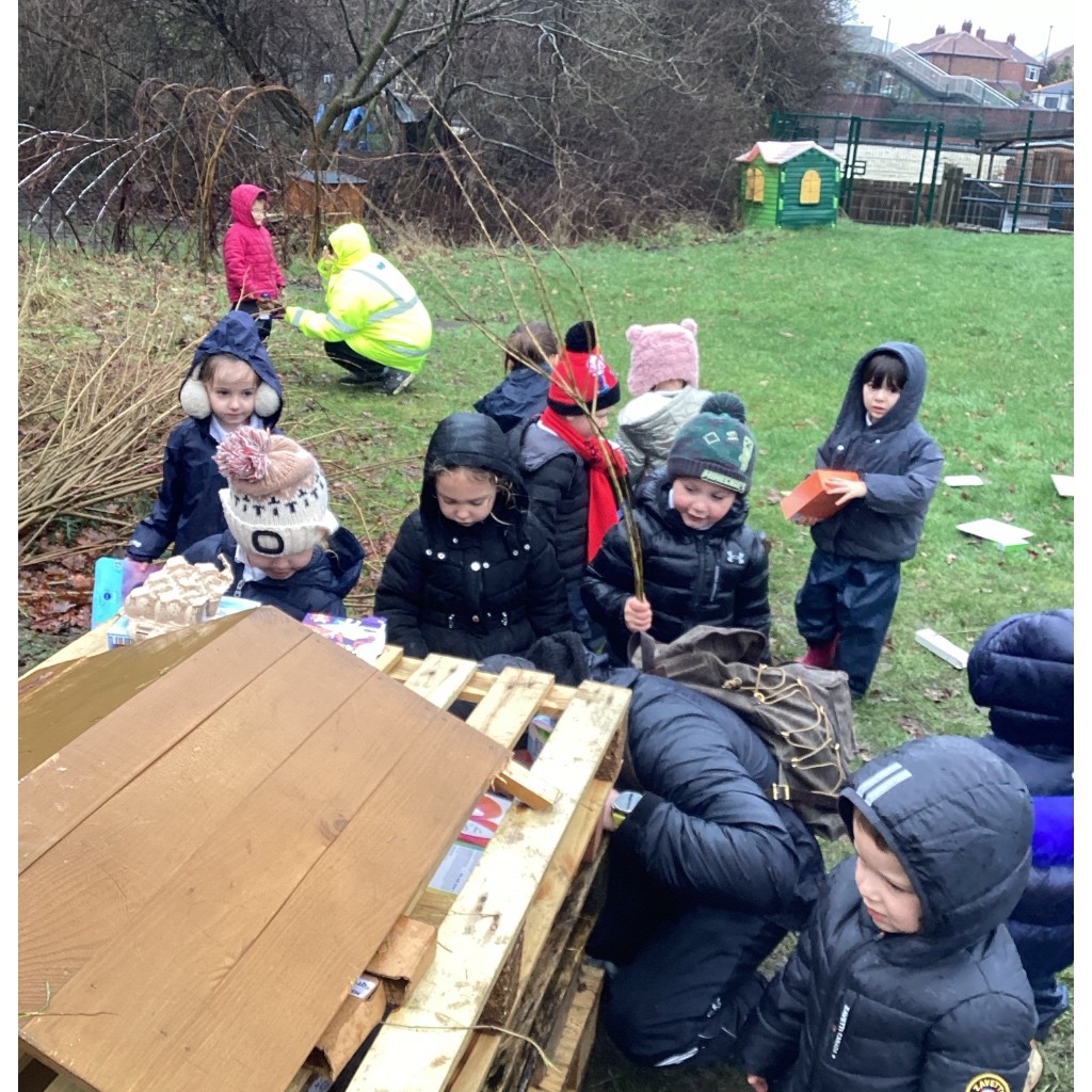 Working together to build our bug hotel