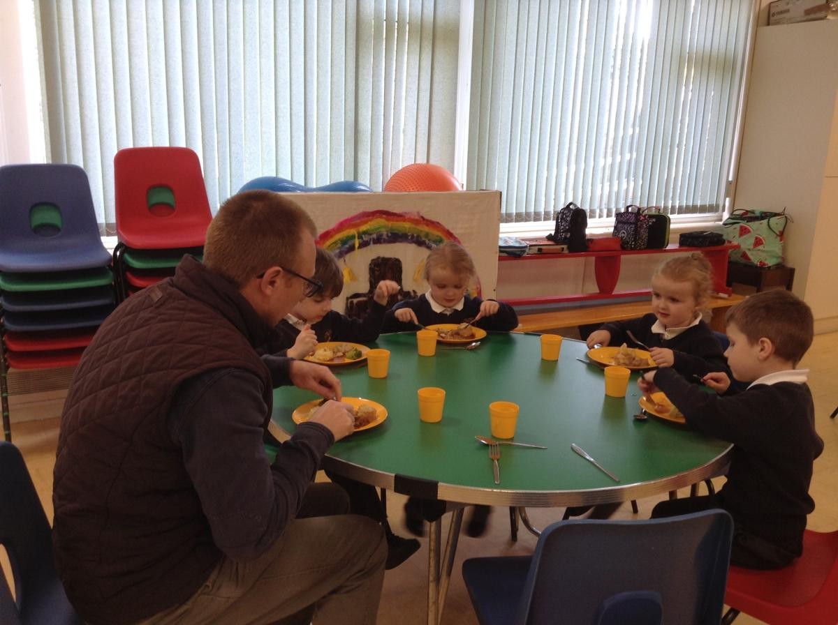 Governors sharing lunch with the children